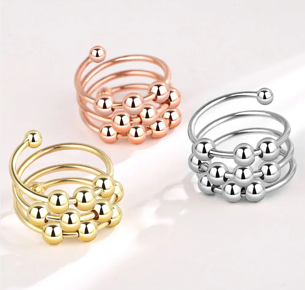 Draaiende ring met 10 kralen - zilver, rosé of goud