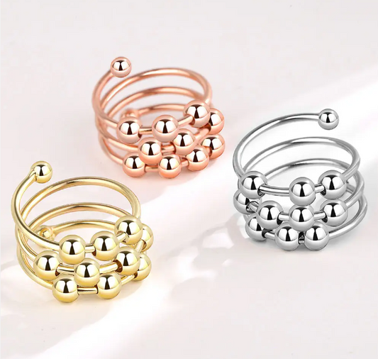 Draaiende ring met 10 kralen - zilver, rosé of goud