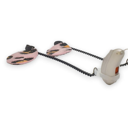 Boutons d'oreilles à imprimé animal rose pour appareils auditifs